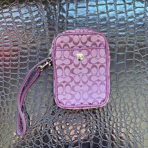 Purple Coach travel case
